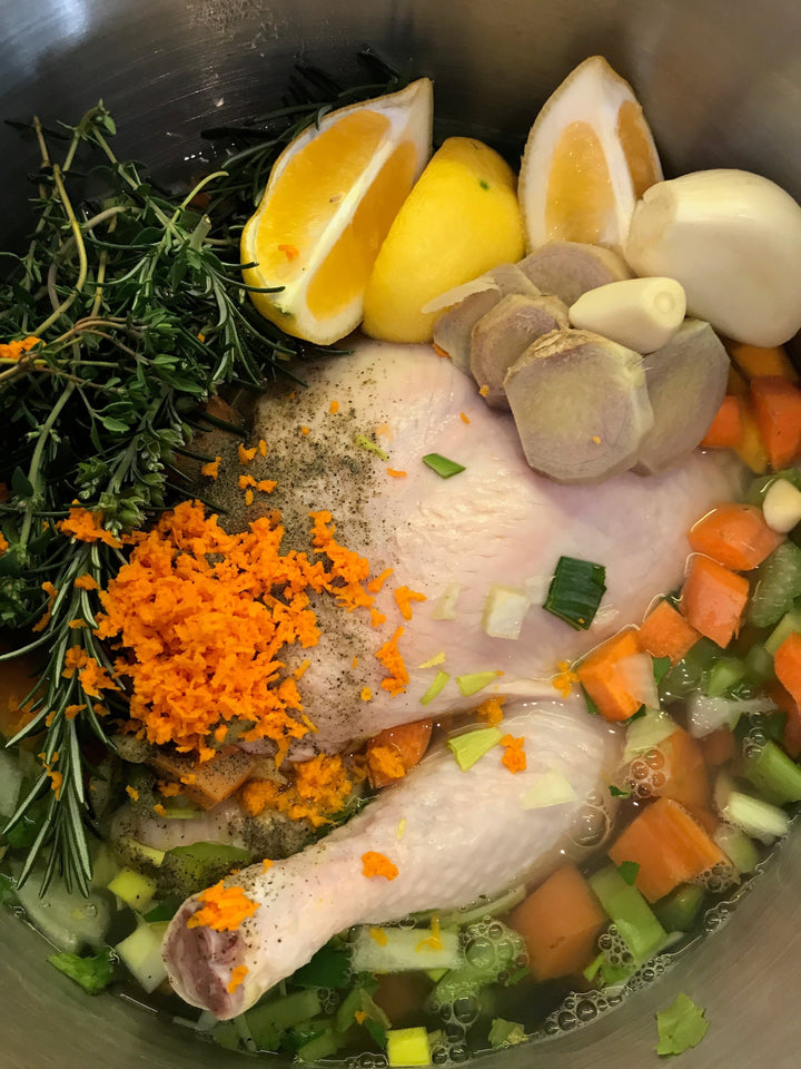 chicken broth in a pot image