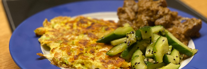 cabbage pancakes with cucumber salad and beef rendang style curry