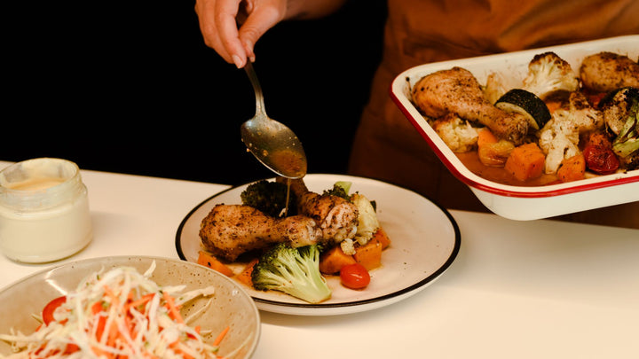 tray bake of roast chicken and vegetables seasoned with organic herbs and spices
